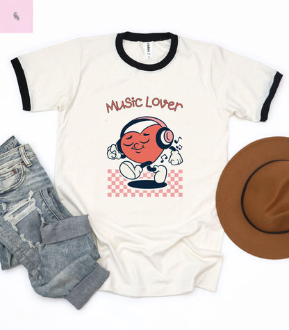 Music Lover Unisex Cotton Ringer T-Shirt – Perfect Gift for Music Enthusiasts The flirty crow
